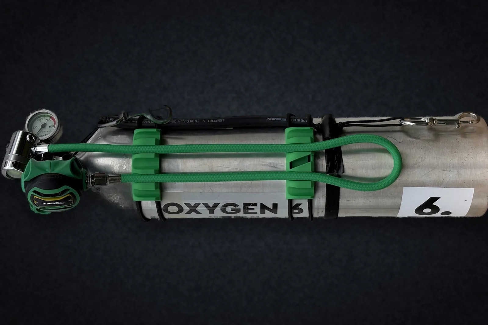 HoseDock™ pair holding two hoses flat on a stage cylinder