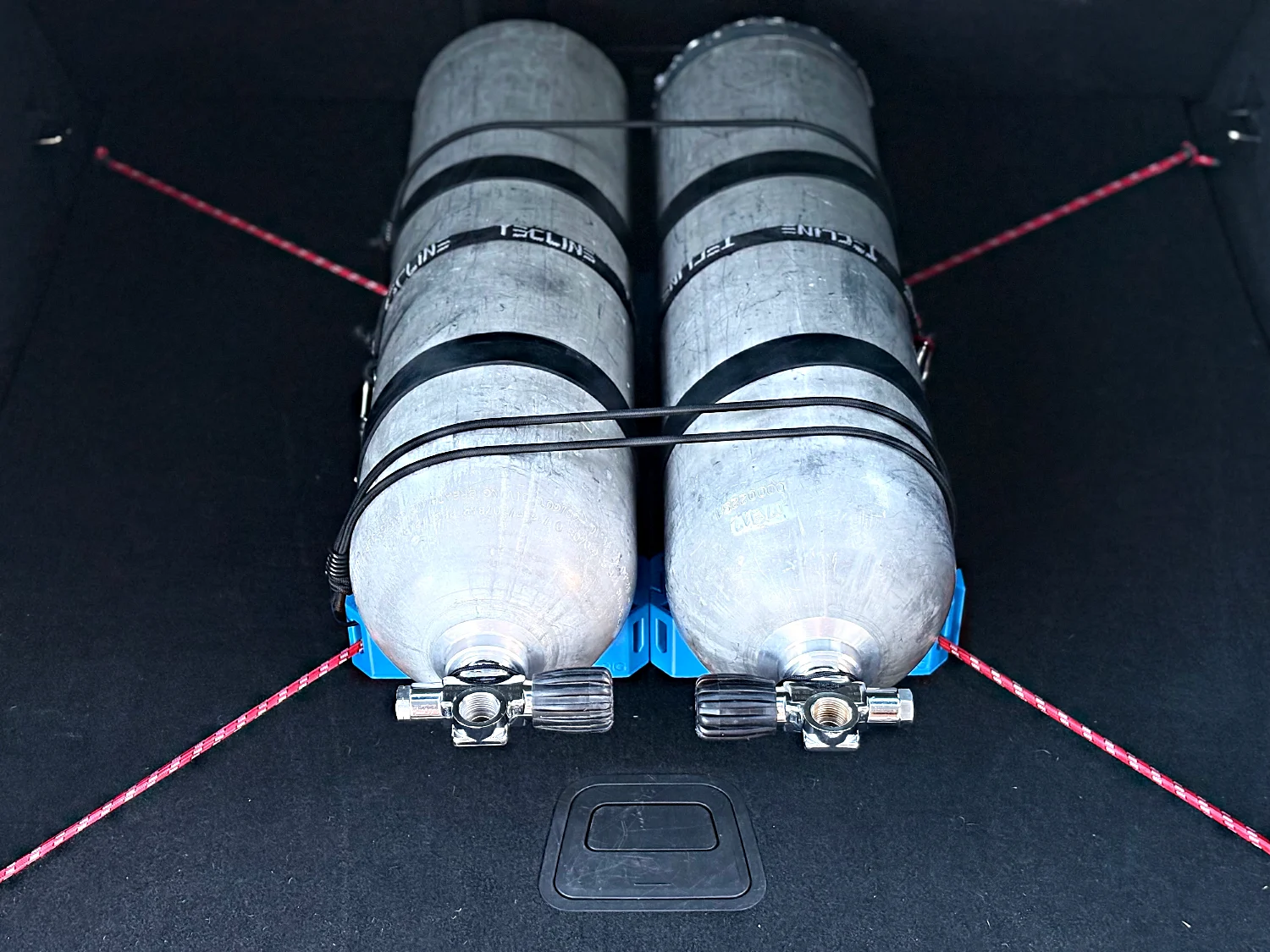 Twinset in the boot, bungee over both tanks