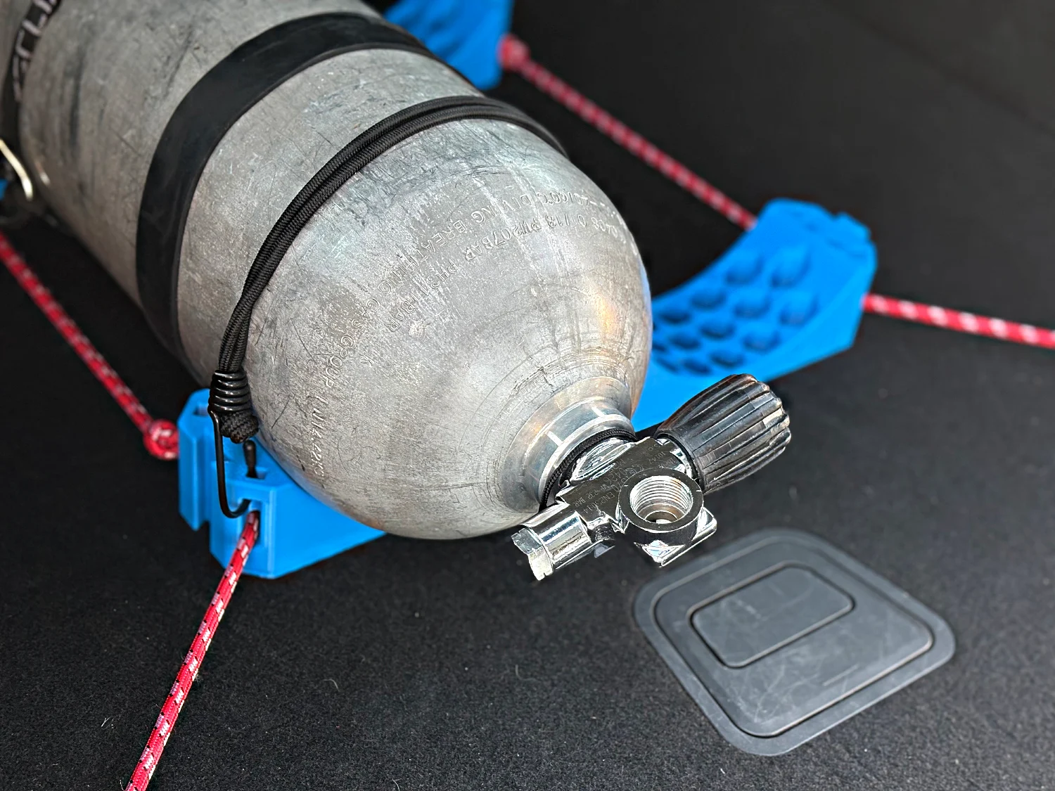 A single cylinder tied down in the boot