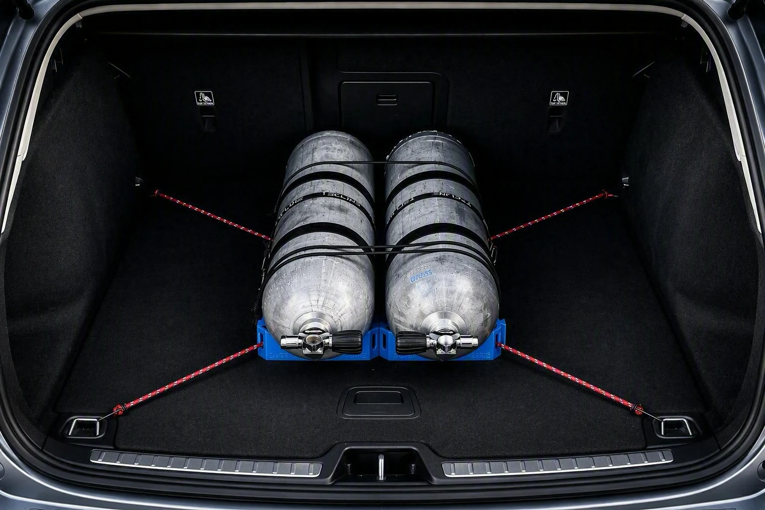 Twinset held by TankLock™ modules and cross-tied in a car boot